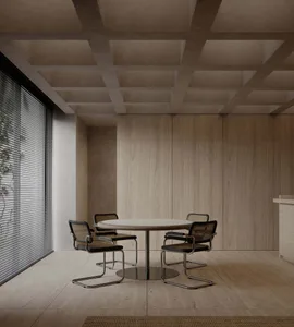 A modern office conference room featuring wooden walls and a round table.