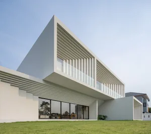 Contemporary residential building with modern design elements such as concrete and glass