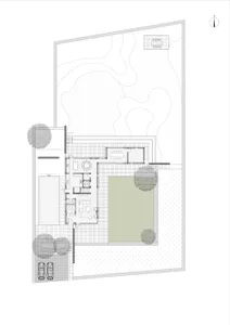 Floor plan of a modern residential building with concrete and glass materials.