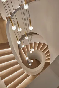 Industrial-style staircase with modern lighting design.