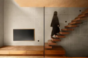 A modern home interior featuring a staircase made of wood.