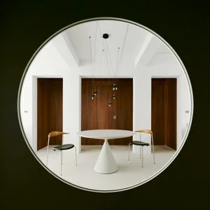Modern minimalist interior with concrete flooring and contemporary furniture.