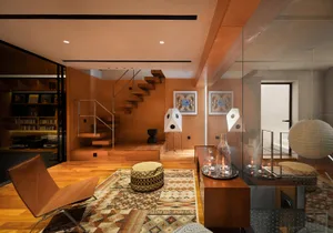 A modern minimalist living room featuring wooden flooring and furniture, with a cozy atmosphere created by comfortable seatin