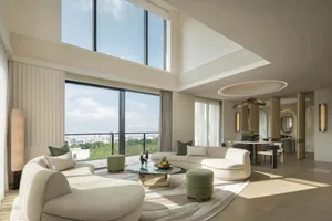Modern living room with patterned textiles on furniture and ceiling accent