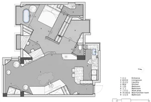 Modern residential interior with concrete, wood, and glass materials.