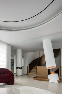 A modern residential interior featuring metallic and wooden elements