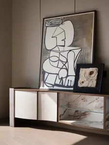 A modern art installation featuring marble and metallic textures.