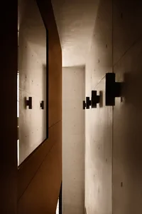 An industrial-style interior design featuring contemporary concrete walls.