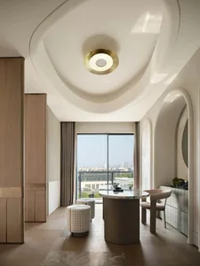 Modern interior design featuring wood, marble, and glass materials.