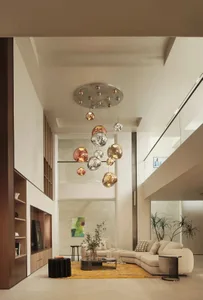Contemporary living room featuring a modern glass and metal chandelier.