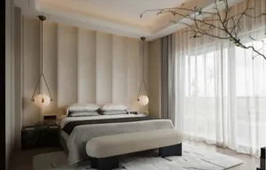 A minimalist bedroom featuring textured fabric walls and lightweight, modern lighting fixtures.