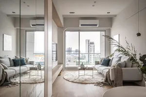 Modern minimalist living room featuring a white sofa, wooden accents, and a large window with city view.