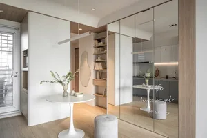 Interior space featuring modern minimalist design with wood and glass materials.