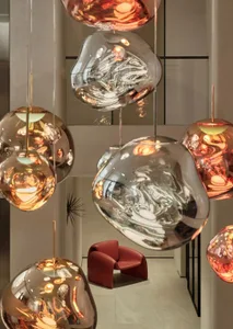 Modern retail storefront featuring glass chandeliers hanging from the ceiling.