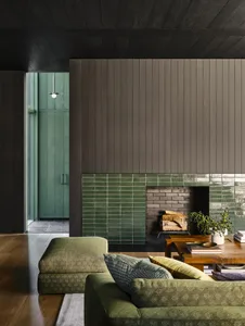 Modern living room featuring a tiled fireplace and wooden accents.