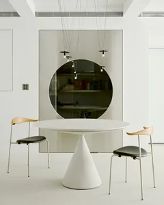 Minimalist design featuring concrete and glass materials in interior space.