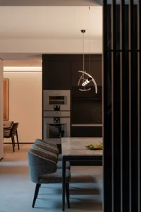 Modern minimalist dining room with marble table and chairs