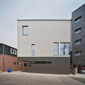 Modern house with tiled and concrete facade