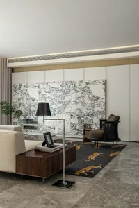 Modern living room featuring a marble backdrop, contemporary furniture, and a leopard-patterned rug.