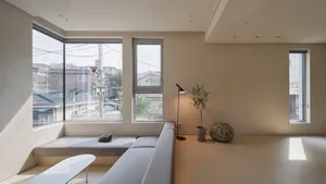 A minimalist living room with neutral-colored materials and a modern aesthetic.