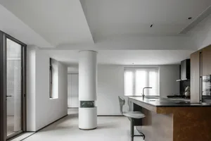 Modern kitchen featuring a sleek metal countertop with minimalistic design elements and clean lines, perfect for contemporary