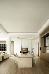 Contemporary residential kitchen with minimalist design and marble island.