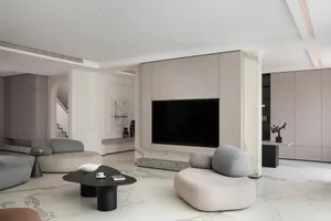 A modern interior lounge area with marble flooring, featuring a minimalistic design aesthetic.