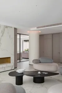 Modern living room with marble accents and a minimalist design.