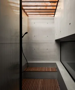Concrete floor and walls in a minimalist bathroom
