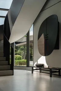 A modern interior design featuring a sleek, minimalist staircase crafted from metal materials.