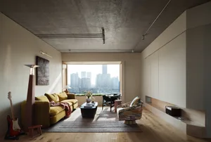 A modern minimalist living room featuring a yellow couch, a coffee table with a vase and a book, a guitar, and a view of a ci