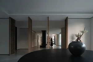 Minimalist living room with wooden lattice and black table