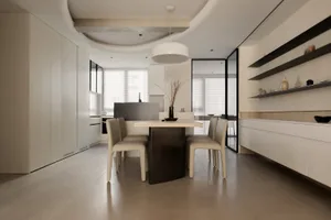 Modern kitchen and dining area with concrete cabinets, minimalist furniture, and sleek design elements.