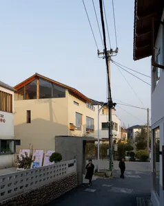 Modern residential neighborhood with concrete, glass, and wood exteriors.