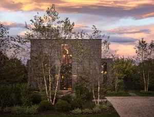 Modern residential house with wood exterior during sunset