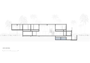 Modern residential floor plan featuring glass walls and open spaces.