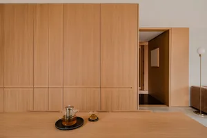 A modern residential interior featuring wooden elements.