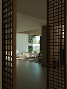A modern interior living space with concrete walls and floor.