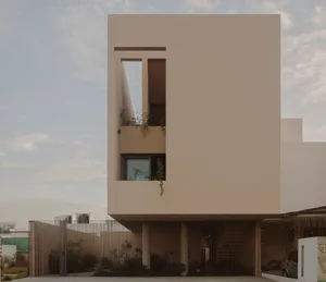 Modern, minimalist building exterior made of concrete.