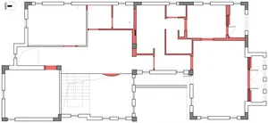 A wireframe architectural blueprint of a modern floor plan.