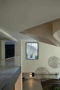 Modern interior with concrete and glass, featuring sleek lines and a contemporary design.