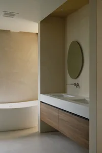 Modern bathroom featuring marble and concrete textures