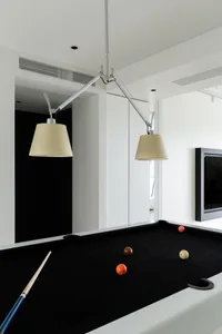 A minimalist pool table room with a modern design.