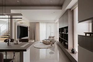 Minimalist living room featuring wood and marble materials.