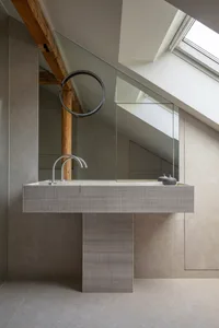 Modern bathroom designed with tile and concrete materials