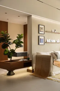 A modern minimalist bedroom with neutral materials and a floating plant pot.