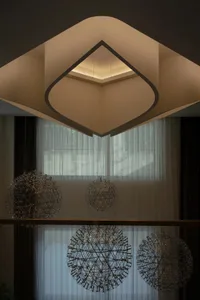 Modern space featuring metallic textured objects with ambient lighting.