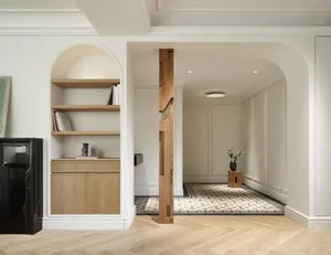 A minimalist residential entryway featuring oak paneling and a checkered floor.