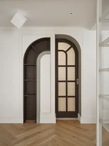 A modern home library with dark wood paneling and arched doorways.