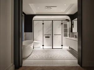 Modern bathroom with marble tiles and glass shower enclosure.